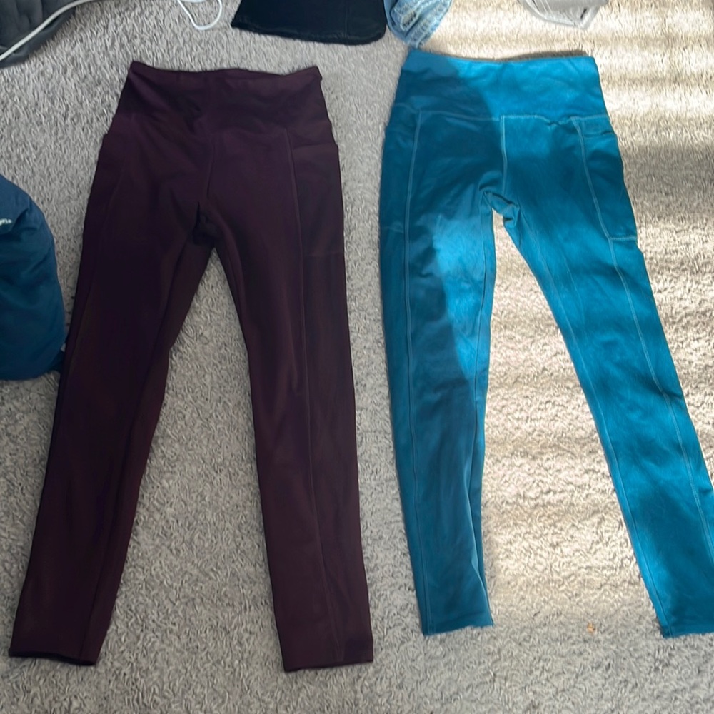 2 pairs of Blue and Maroon colored leggings.